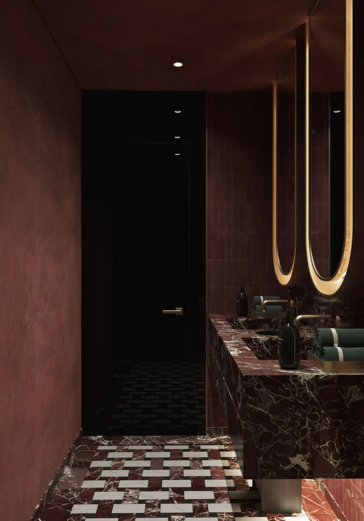 Rosso marble washroom vanity with twin illuminated arched mirrors and burgundy plaster walls