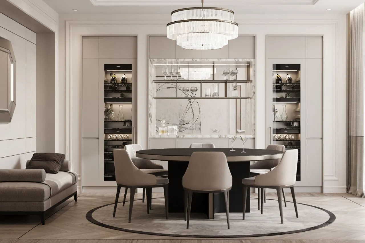 Bar lounge with a round ebonised table, mirrored back bar, tiered crystal chandelier and two glazed wine columns