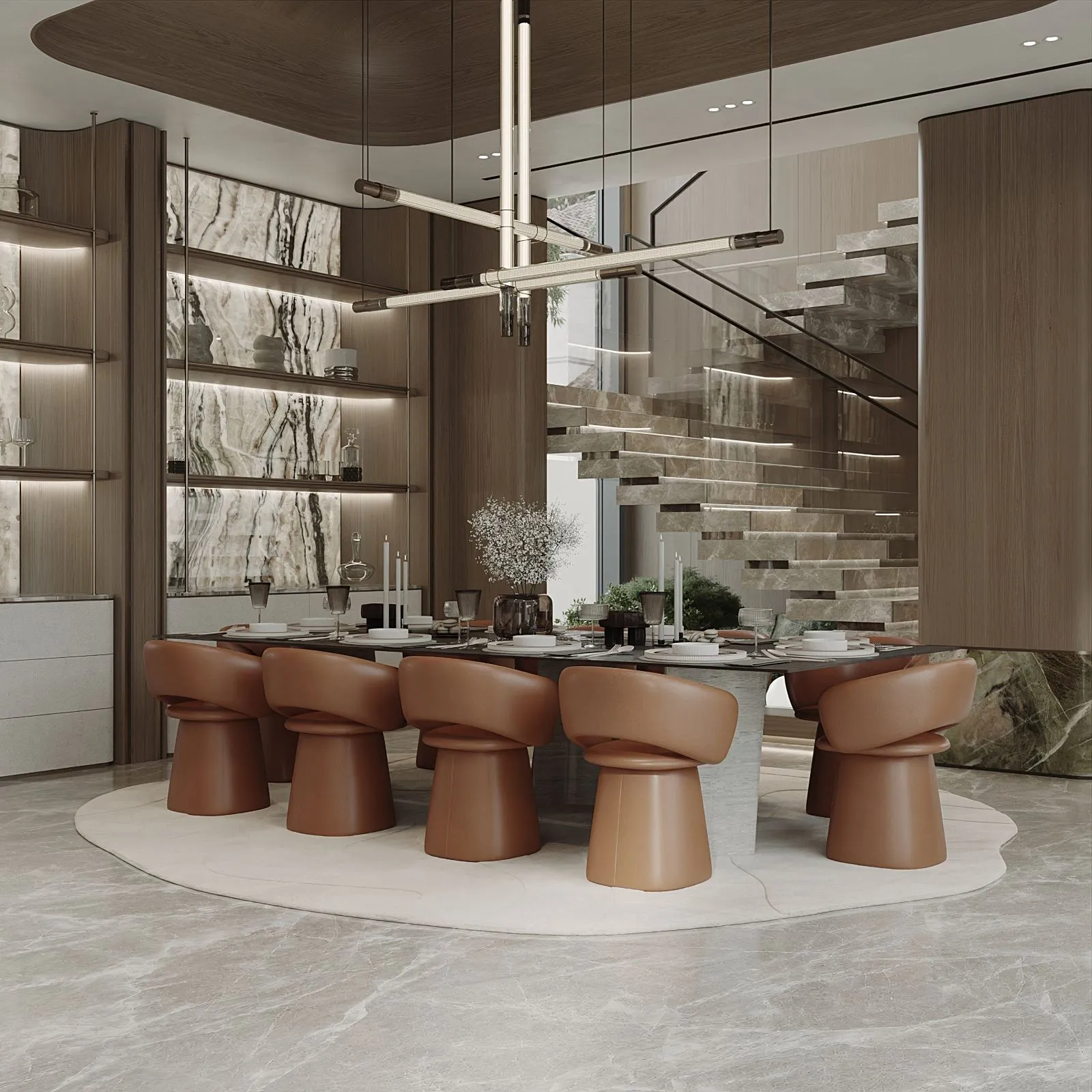 Dining room with a stone table, eight cognac leather tulip chairs, lit marble display joinery and the floating stone staircase behind