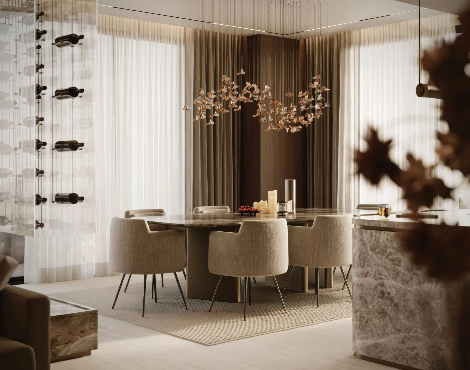 Dining room with a marble table, boucle armchairs, a suspended glass bird chandelier and the wine wall to one side