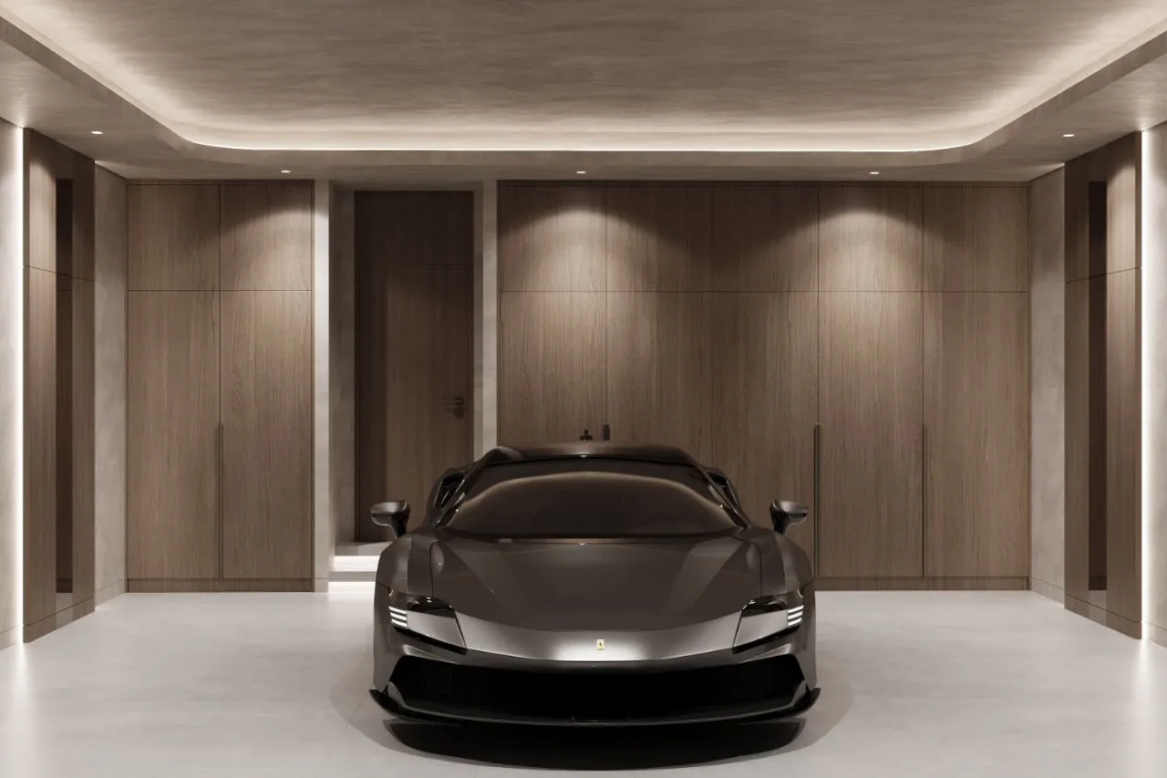 Showroom garage panelled in oak with cove lighting, downlit walls and a pale stone floor