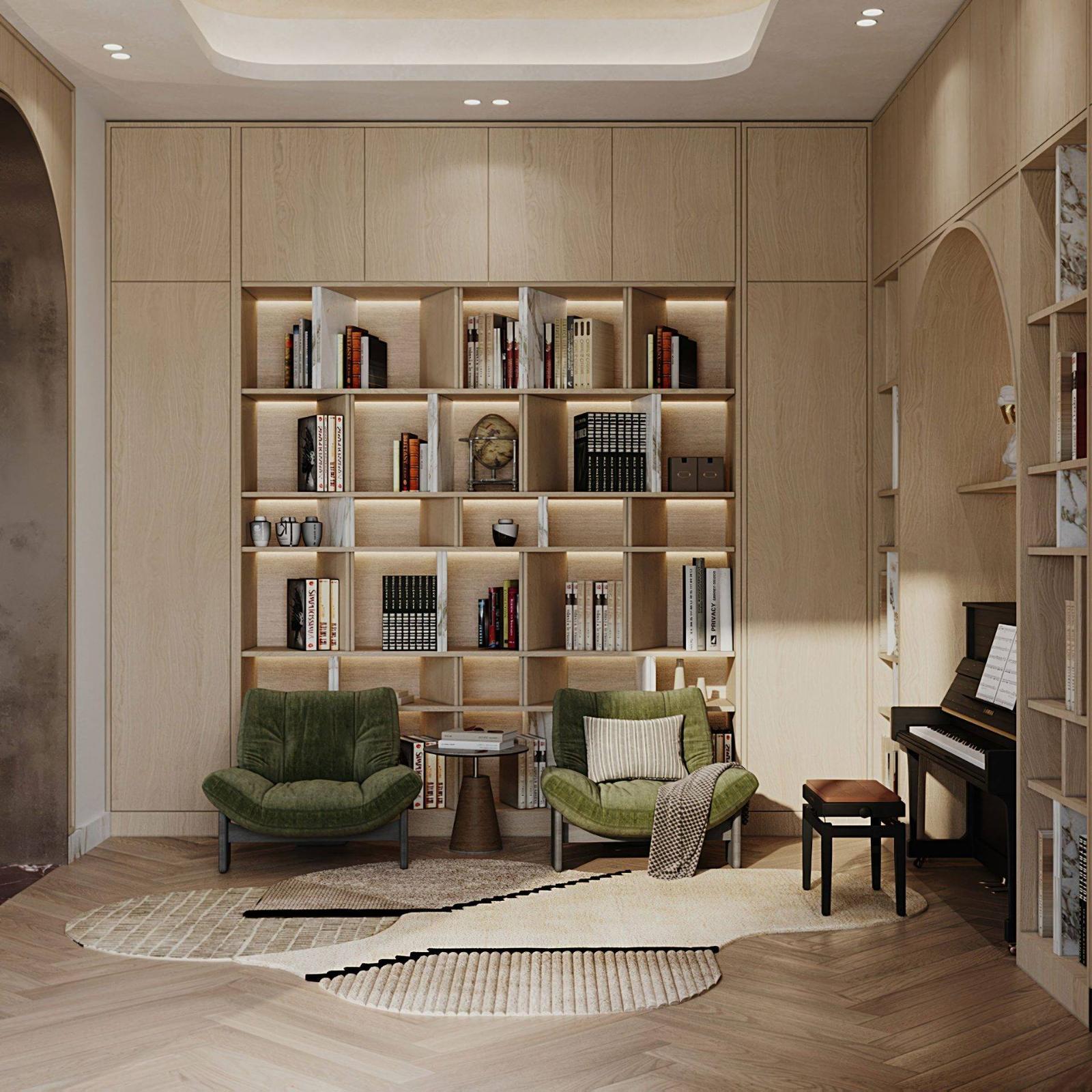 Villa library and music room with a lit oak bookcase wall, two green velvet chairs and an upright piano