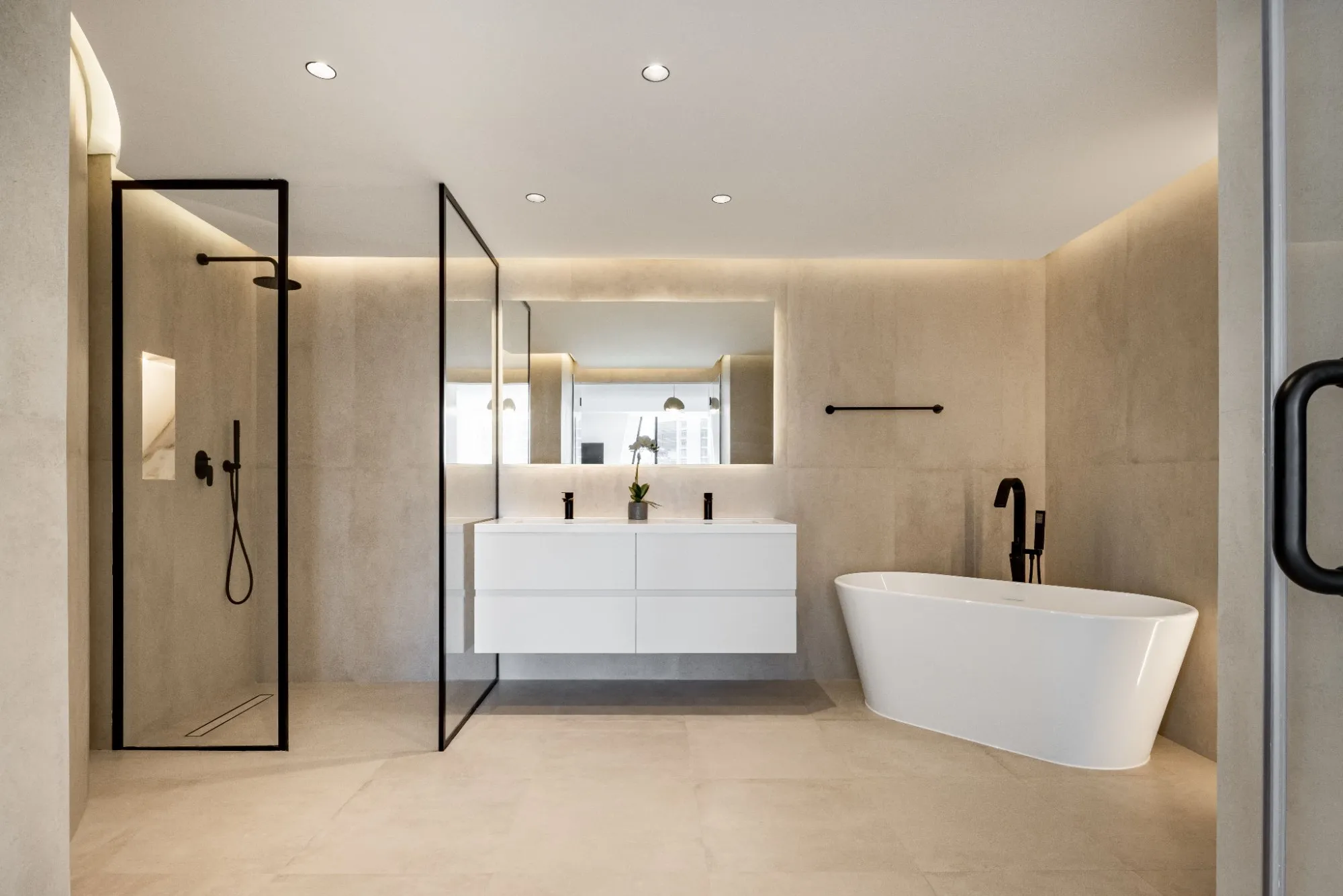Principal bathroom in book-matched marble with freestanding tub