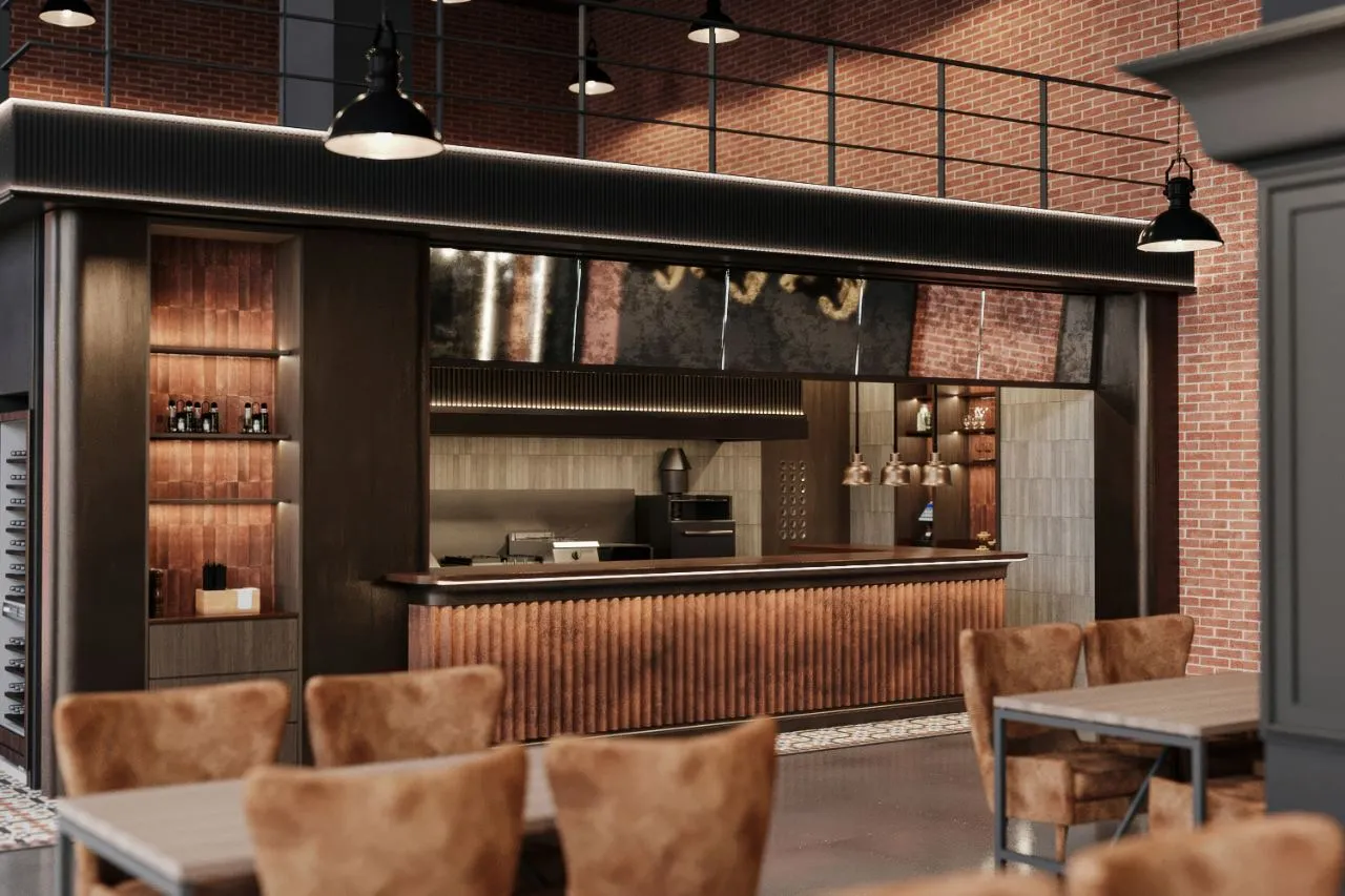 Guest-side view of the grill pass with a cast bull's head on brick, copper counter and cement tile threshold