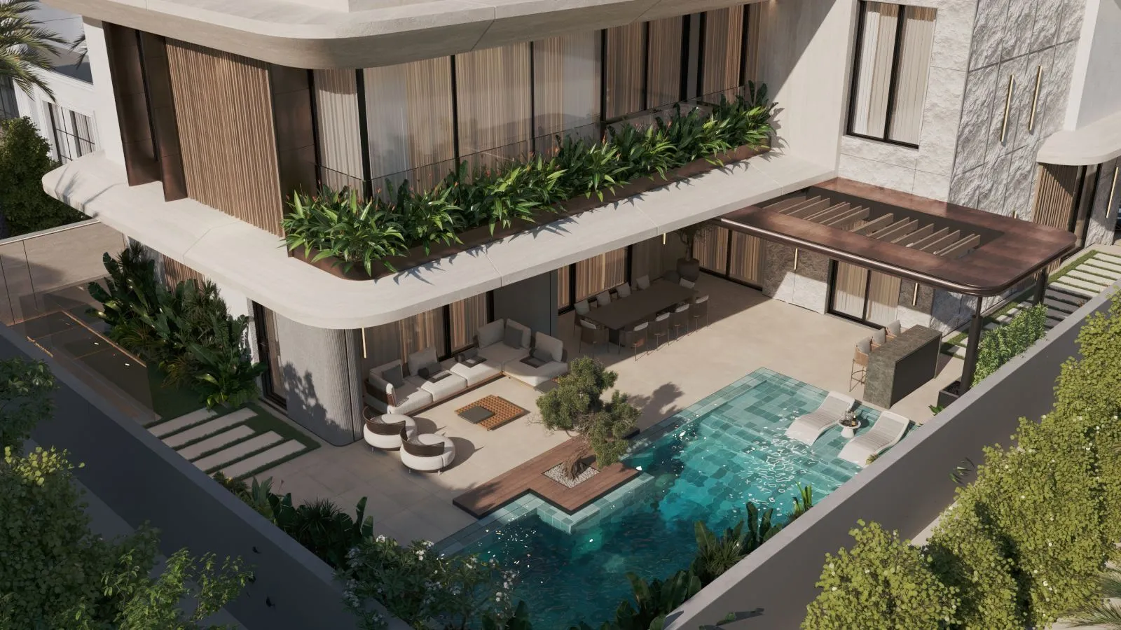 Aerial view of La Mer Villa's pool terrace with green mosaic pool, sun loungers, outdoor kitchen, shaded lounge and dining under a cantilevered slab