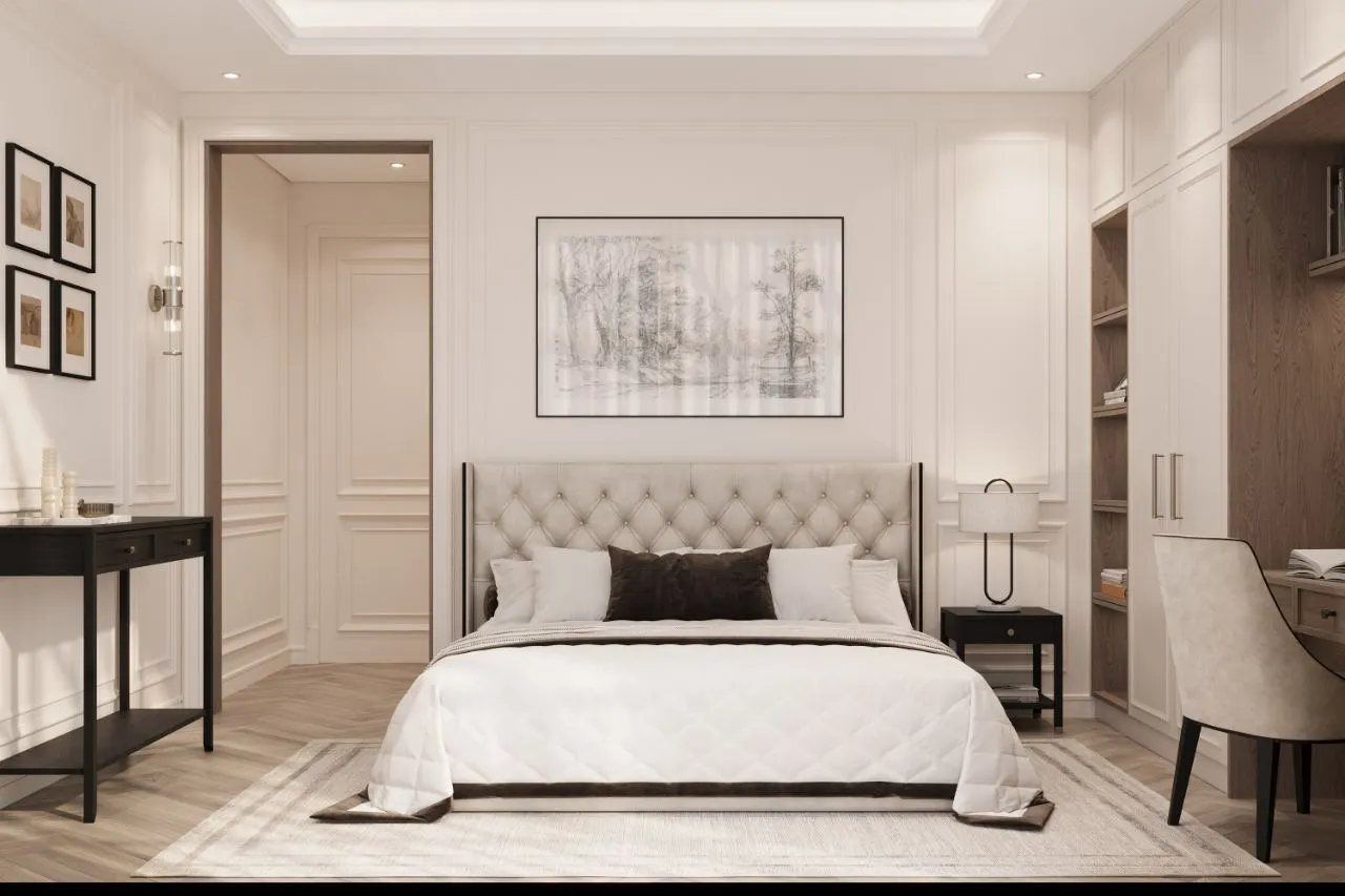 Guest bedroom with a diamond-tufted headboard, ivory panelling, ebonised console and a built-in oak desk