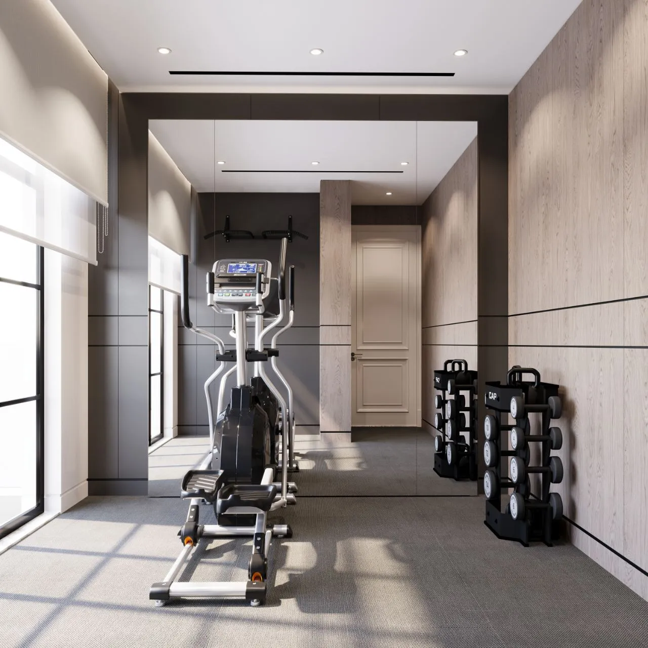 Private gym with a full mirror wall, oak and graphite panelling, cardio equipment and dumbbell racks