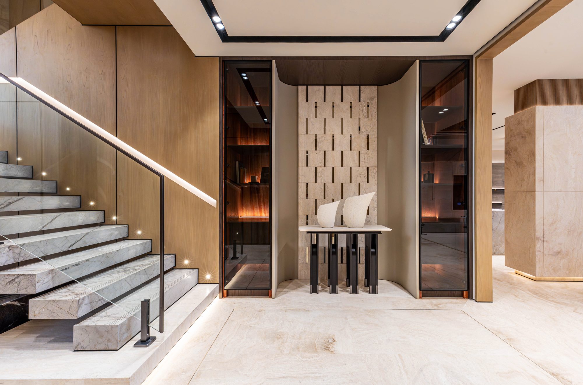Entrance hall with staircase and display vitrines