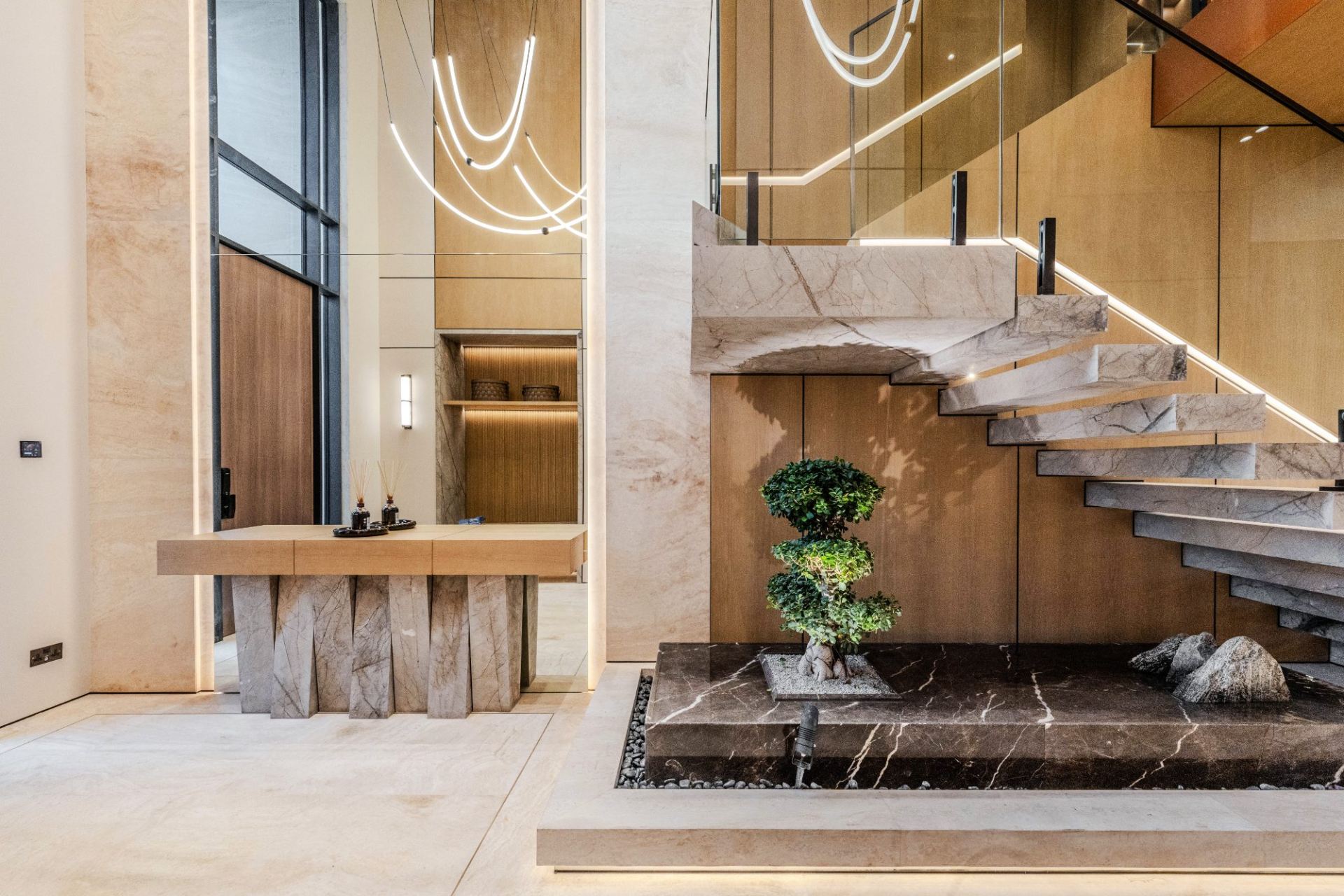 Floating marble staircase over zen water garden