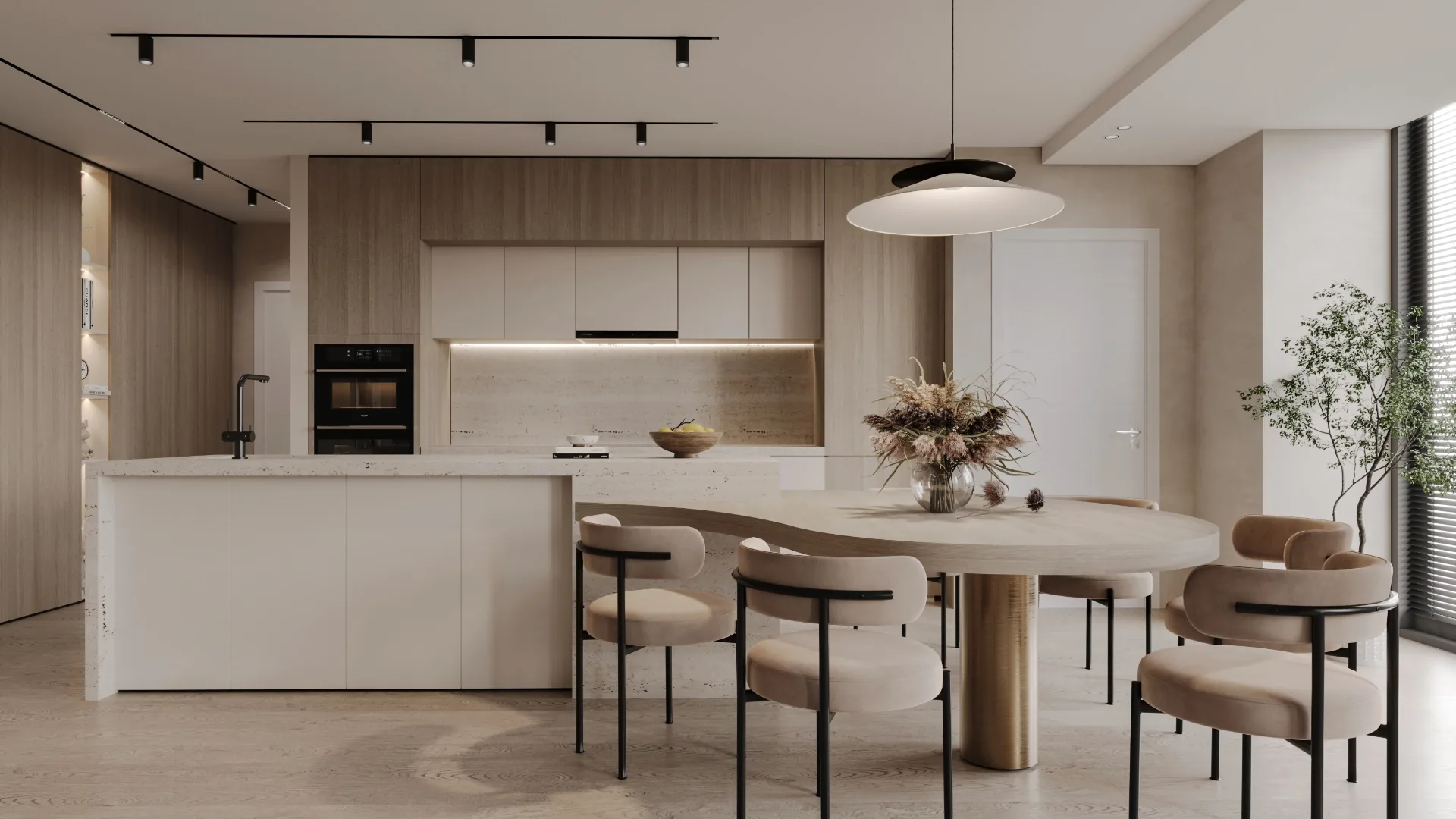 Travertine kitchen island joined to a curved oak dining table