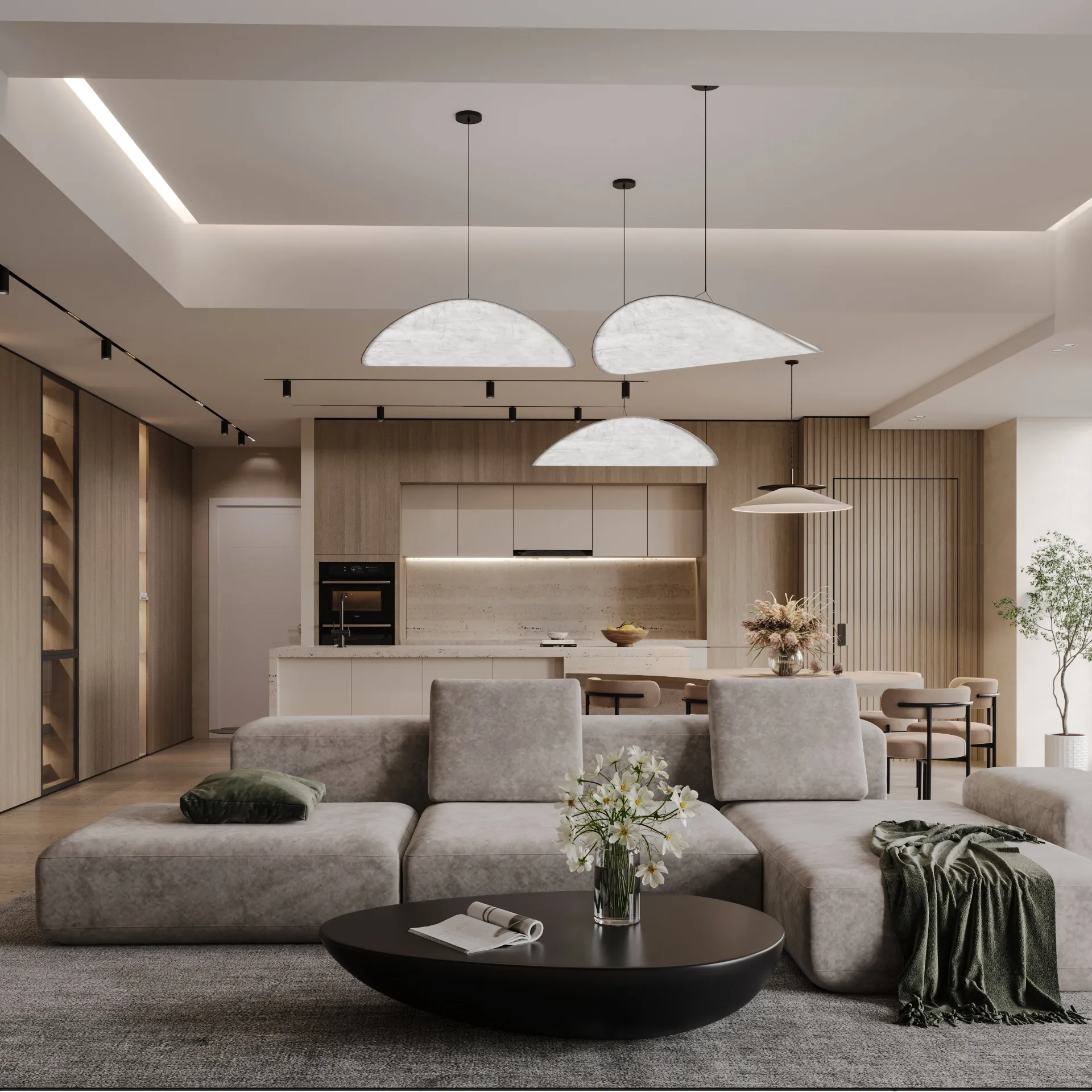 Lounge with modular grey velvet sofa, black coffee table and leaf pendants