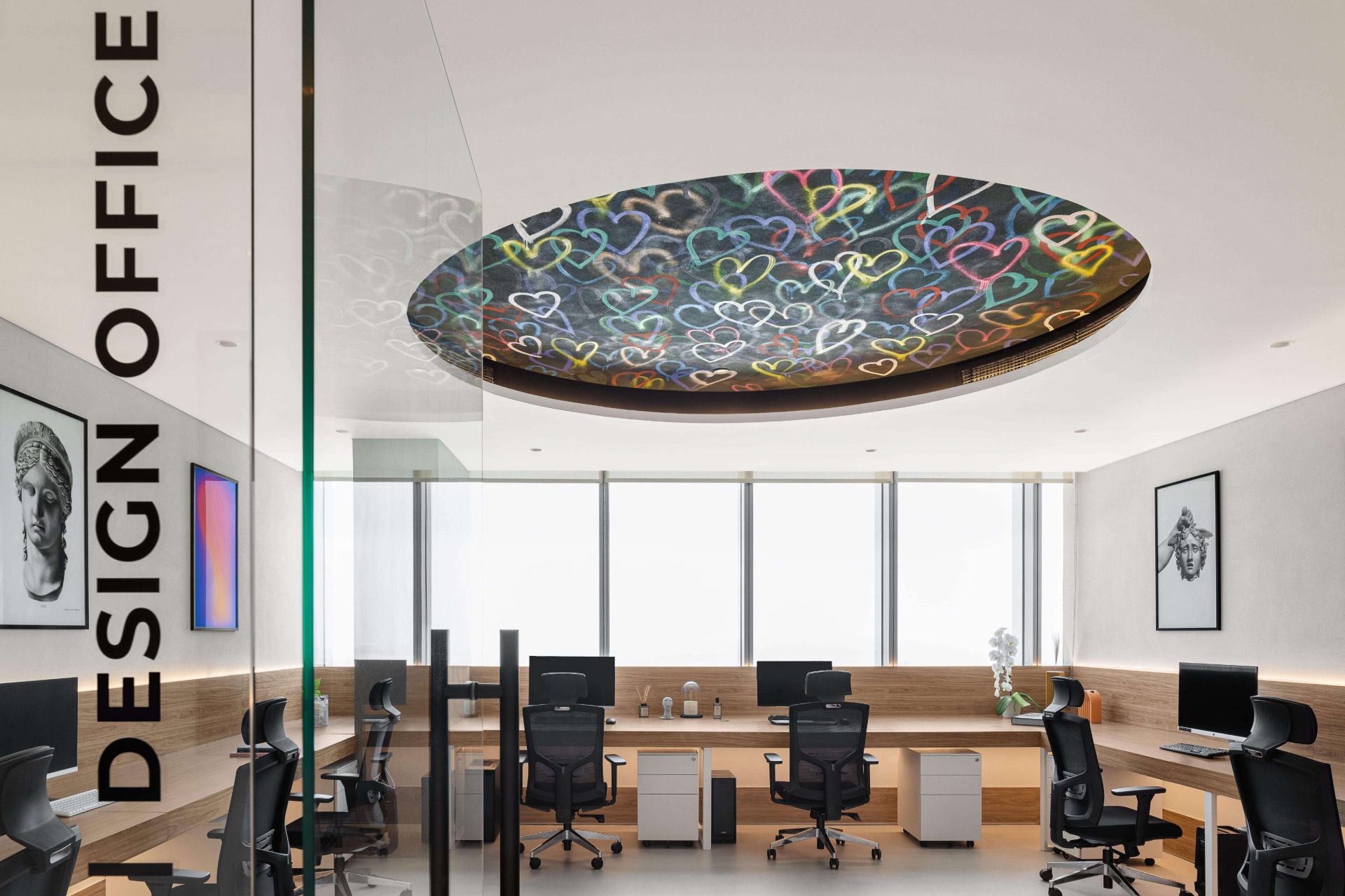 K4 design office with statement ceiling and curated art
