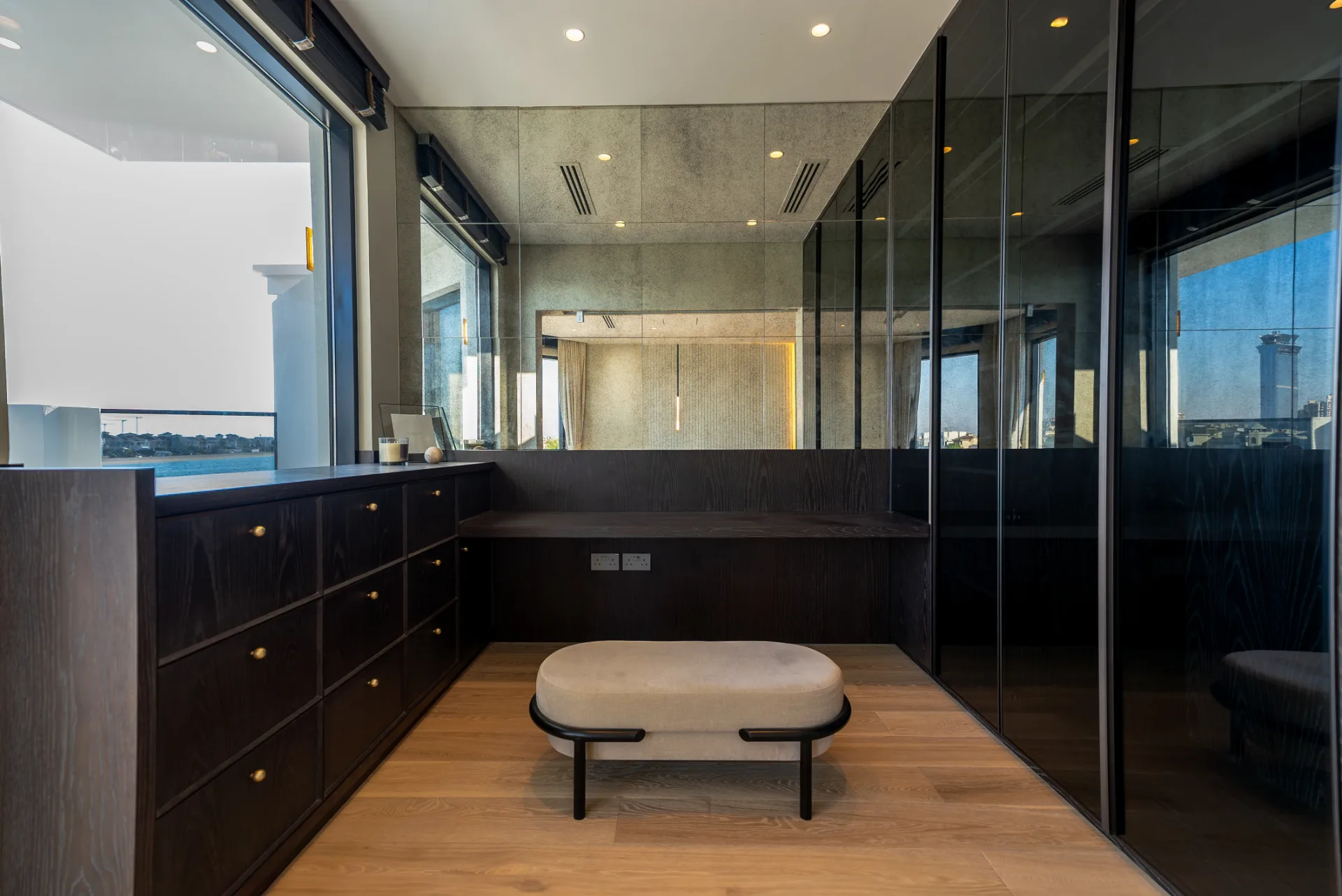 Smoked-oak dressing room with sea view