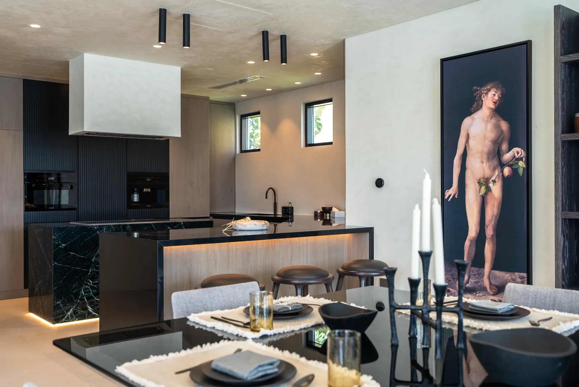 Black marble and oak kitchen with dining
