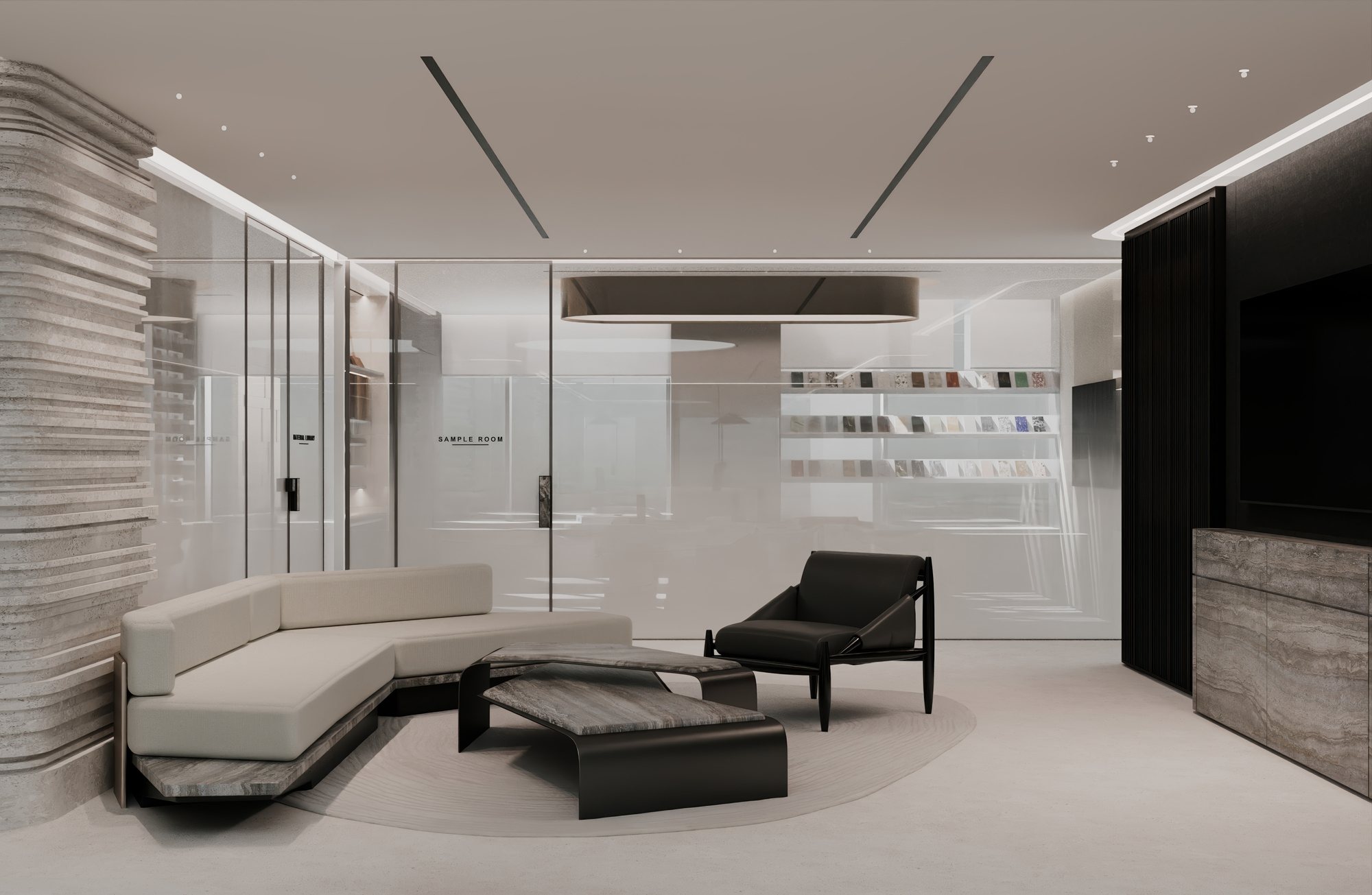 Client lounge with curved sofa facing the glass sample room