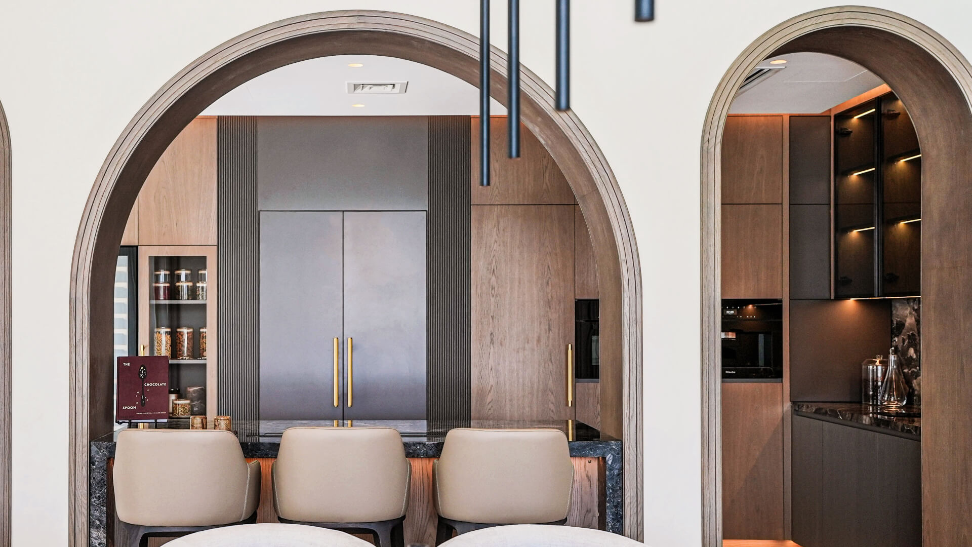 Arched oak kitchen with stone island