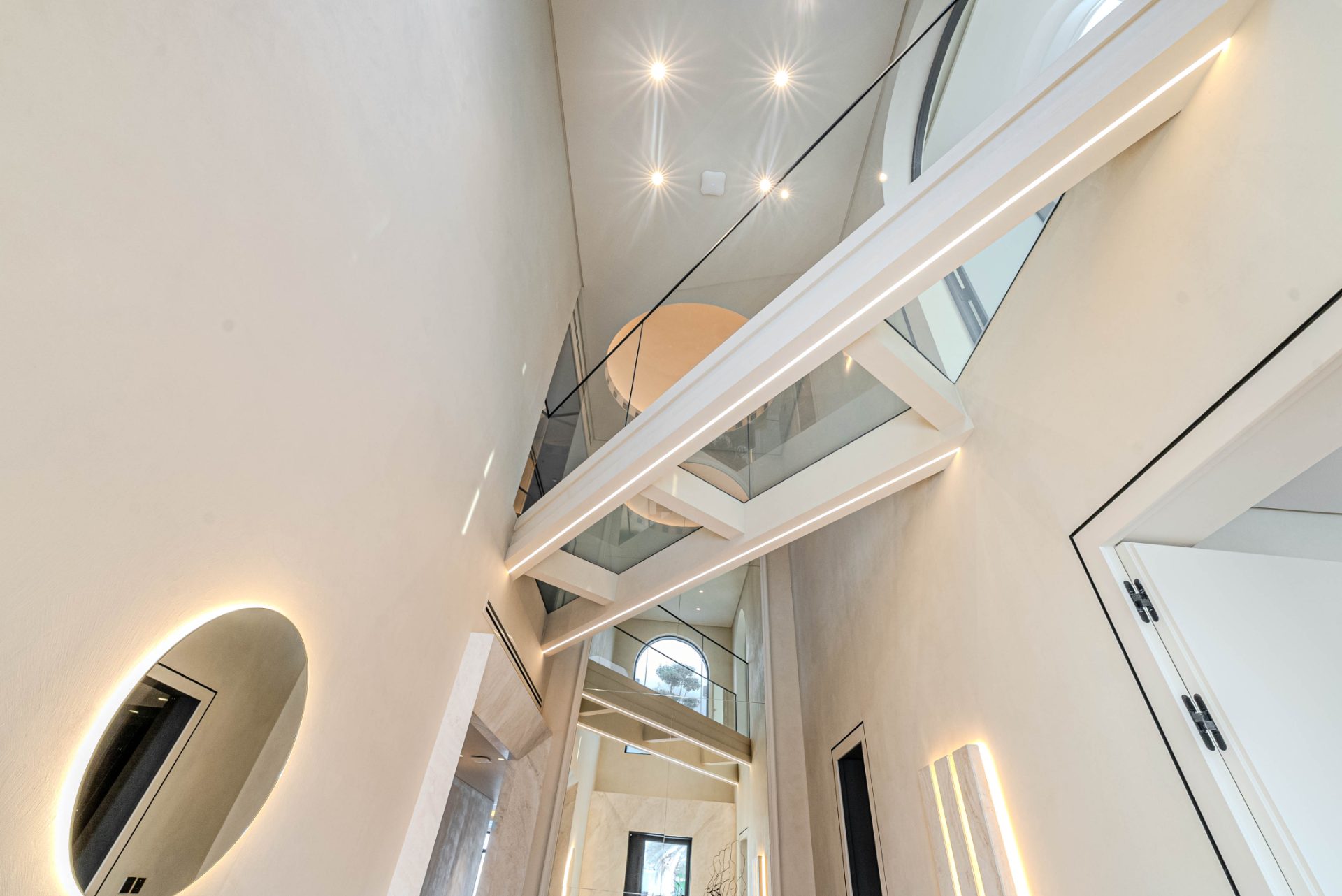 Sculptural floating staircase in a double-height atrium