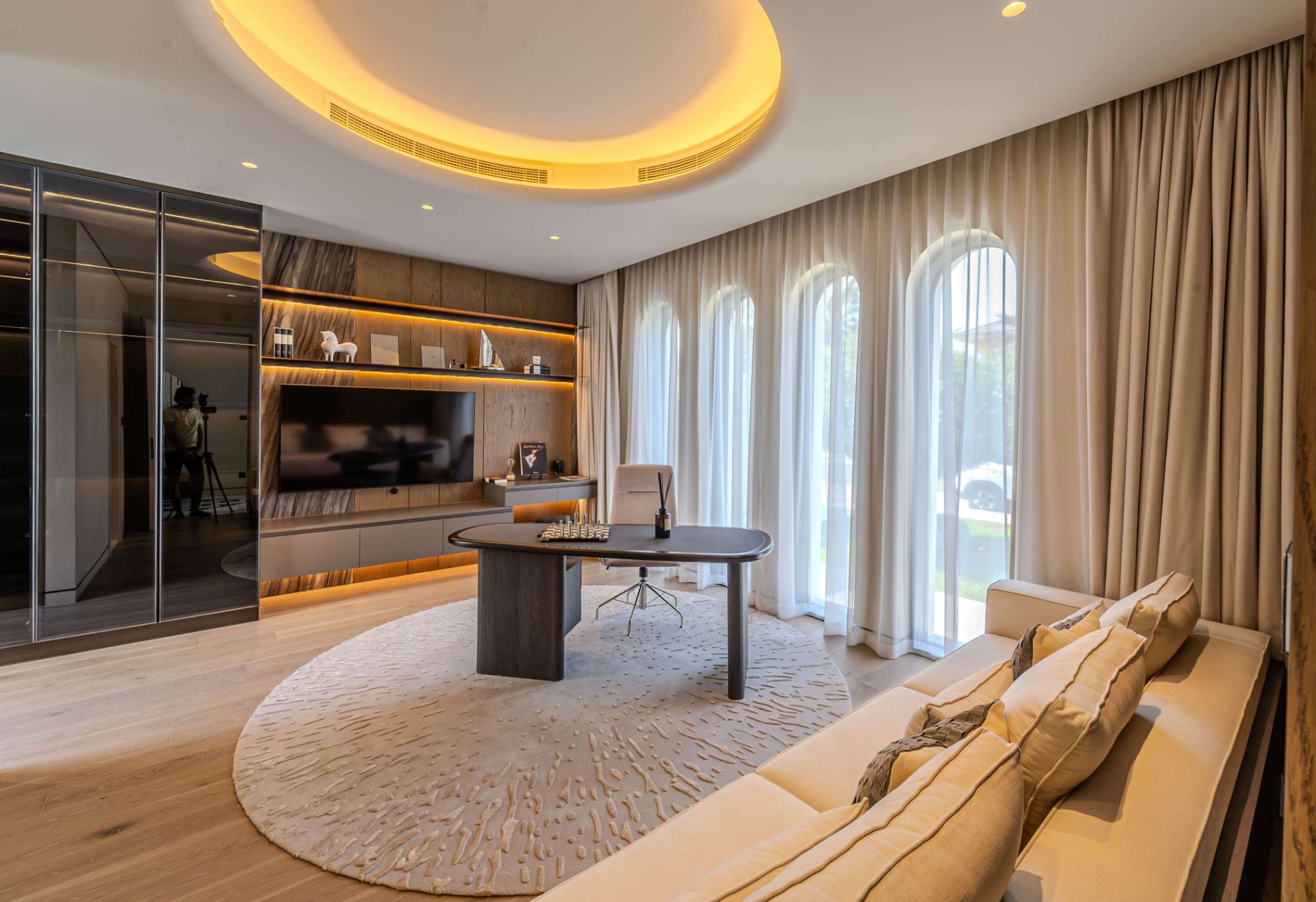 Study with circular ceiling cove and arched windows