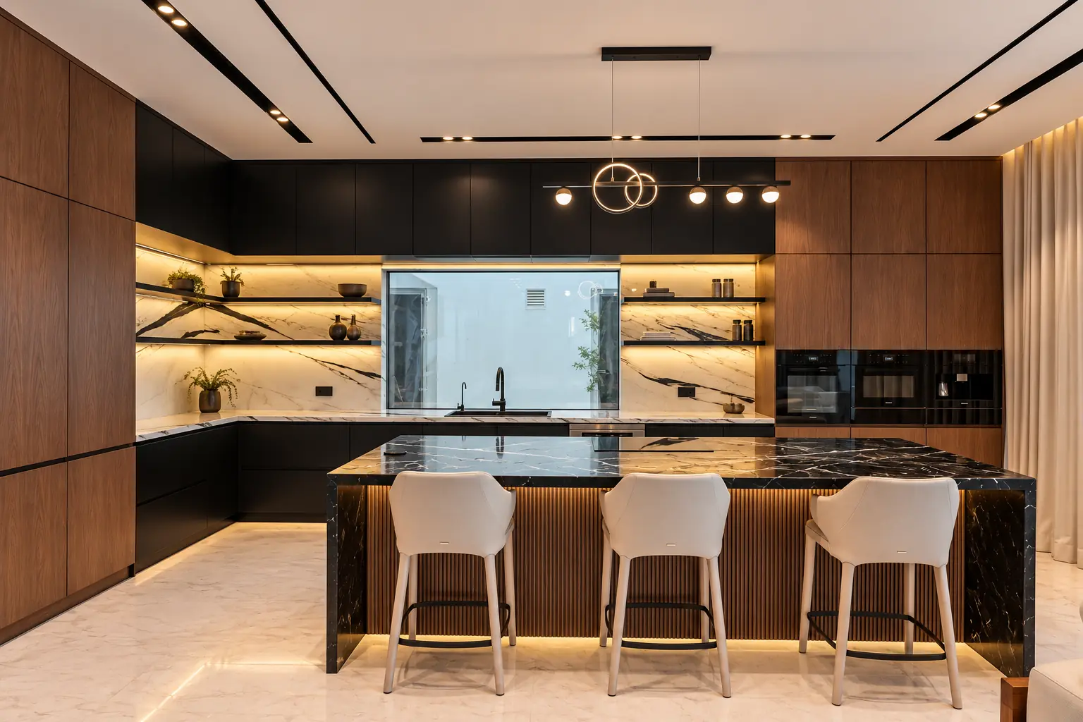 Kitchen with a black marble waterfall island, fluted walnut base, lit marble splashback with floating shelves and integrated ovens