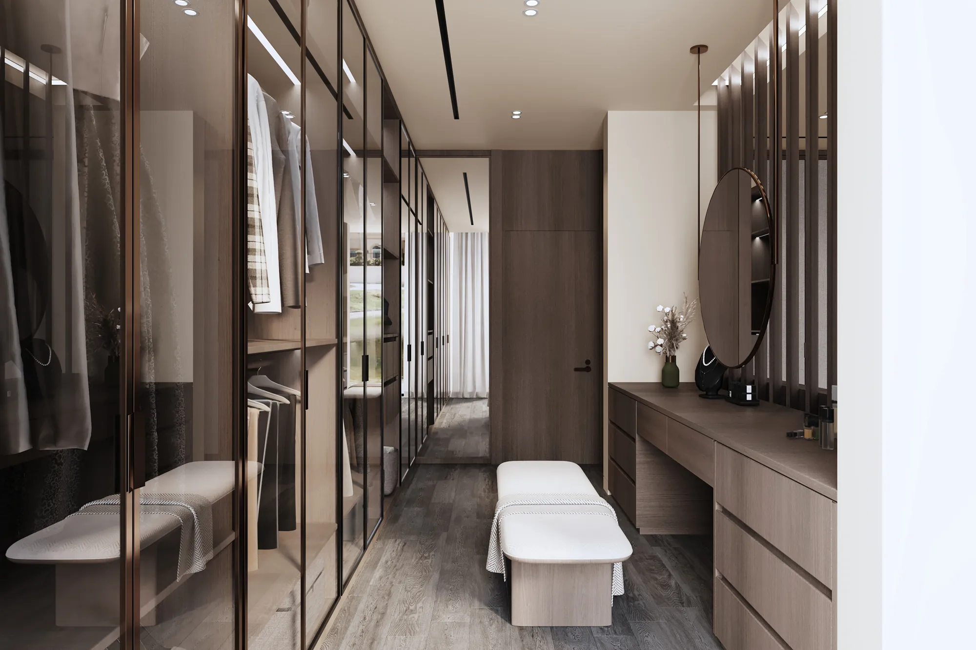 Walk-in dressing room with bronze-framed glass wardrobes, a timber vanity and a suspended round mirror
