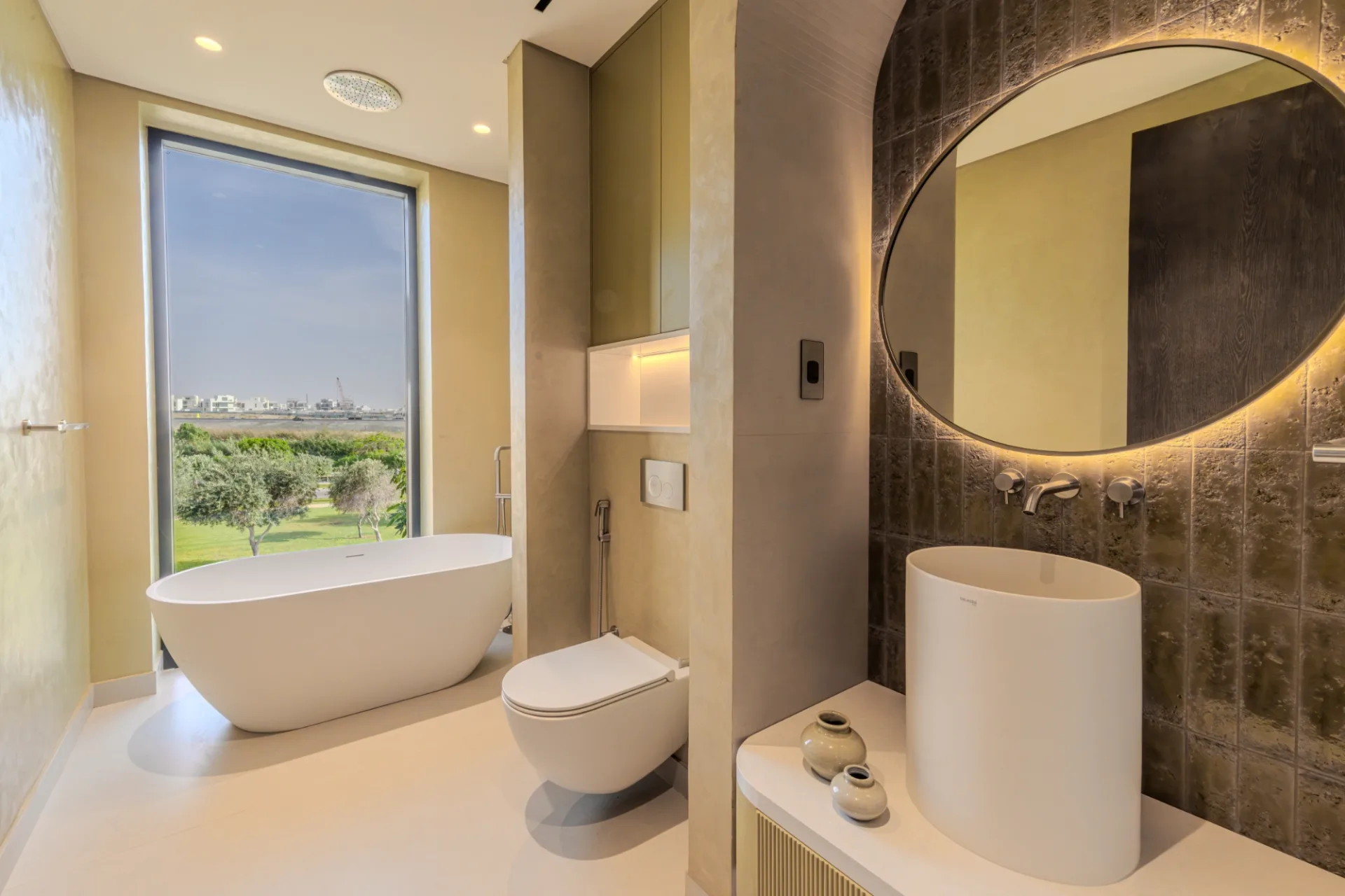 Principal bath with freestanding tub and golf-course view