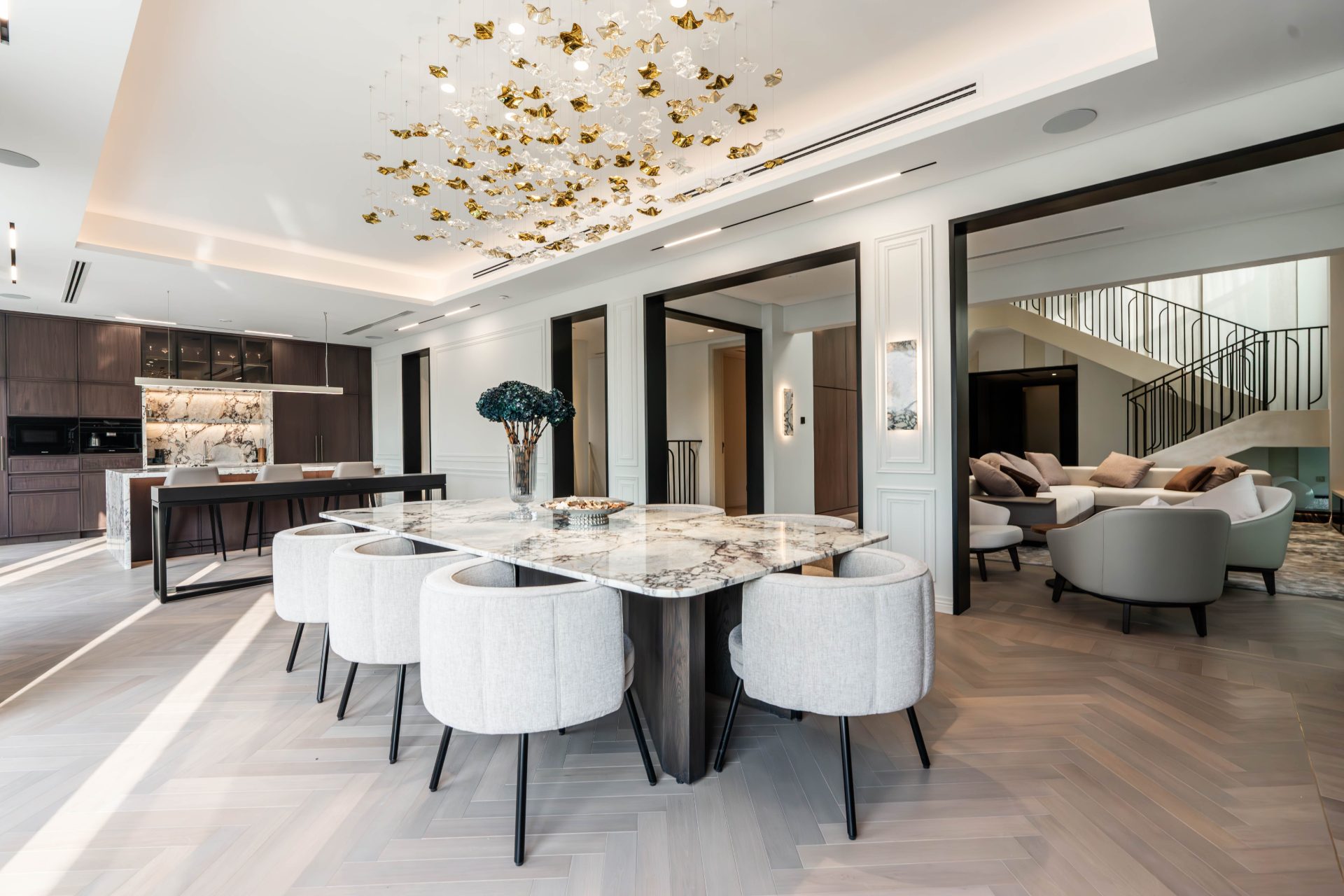 Formal dining room with gold-leaf chandelier