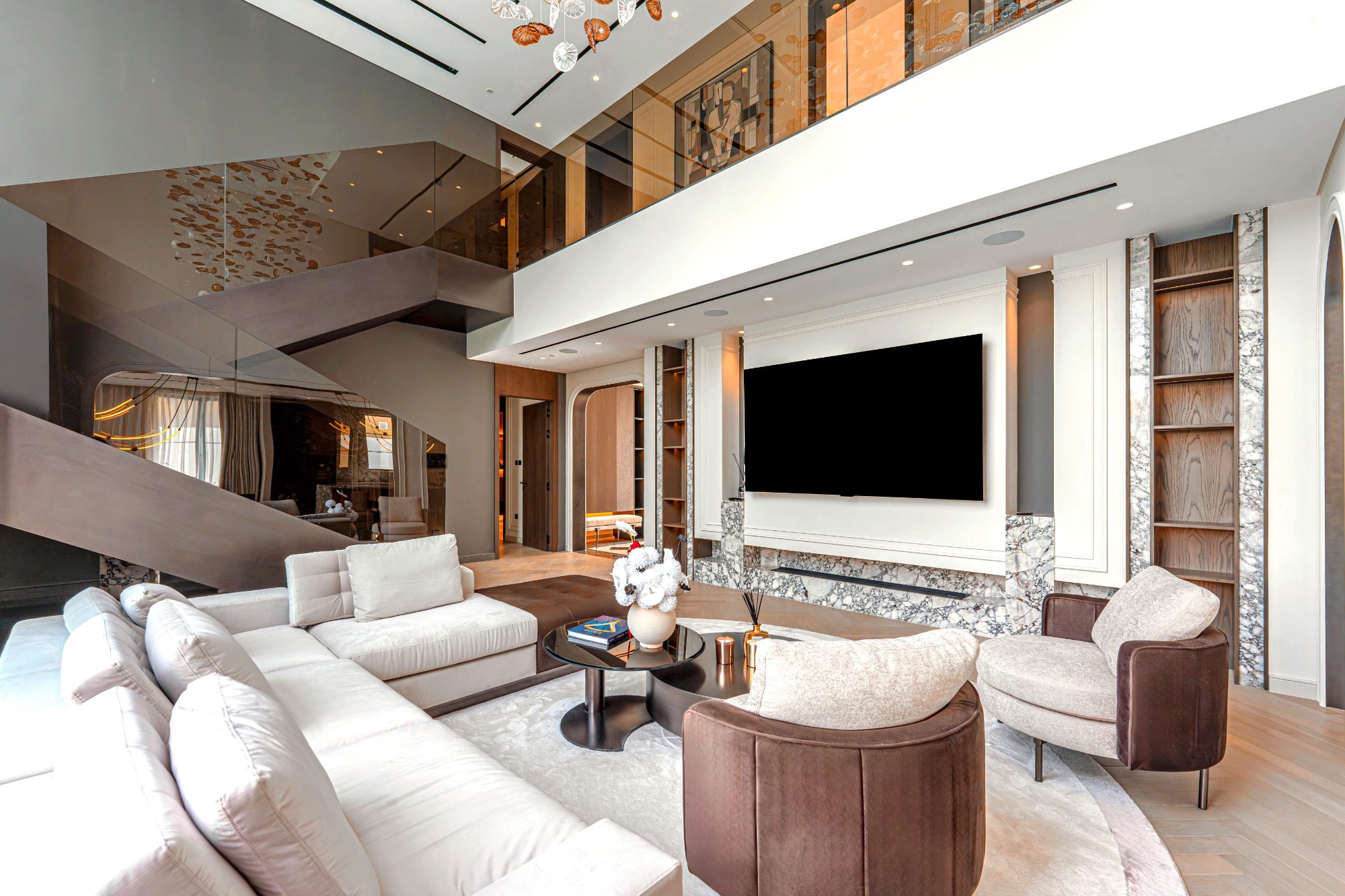 Double-height living room with marble media wall