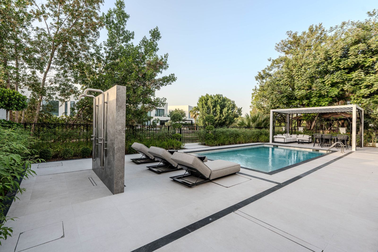 Landscaped garden with pool and shaded lounge