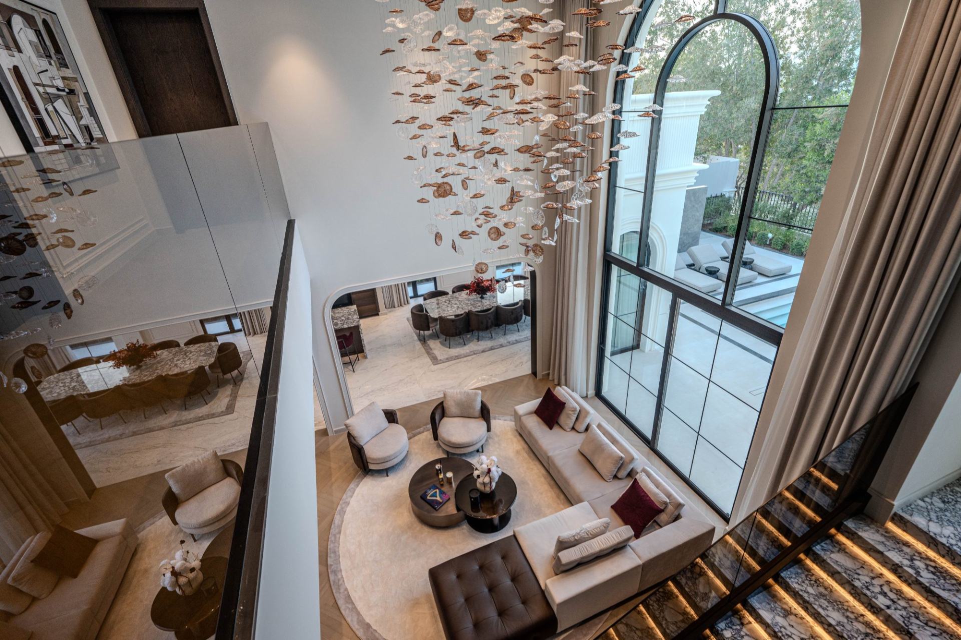 Double-height salon and cascade chandelier
