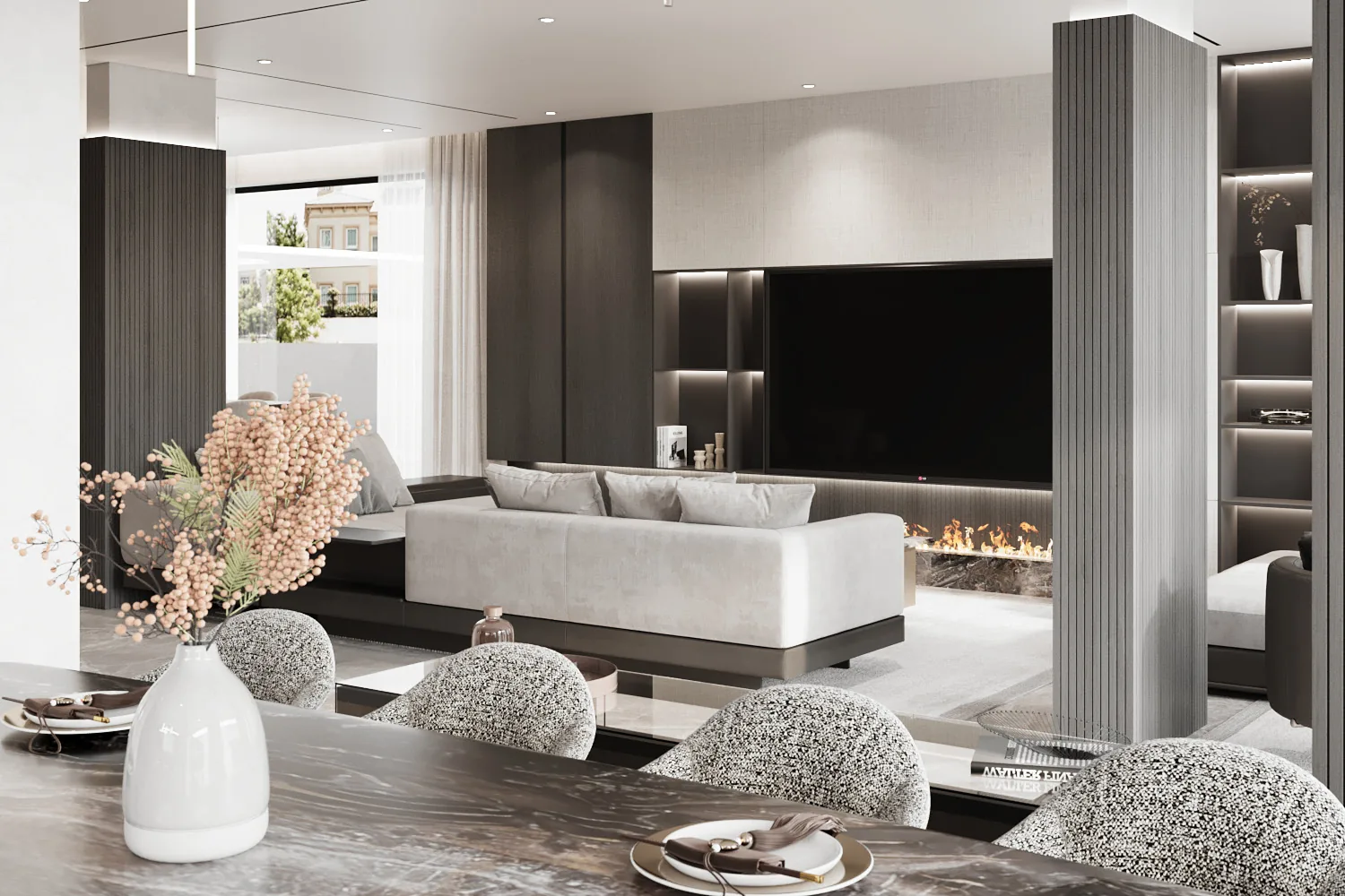 Living room of a Dubai villa fit-out by K4, with a linen and dark timber media wall, linear fireplace, slatted timber columns and a marble dining table