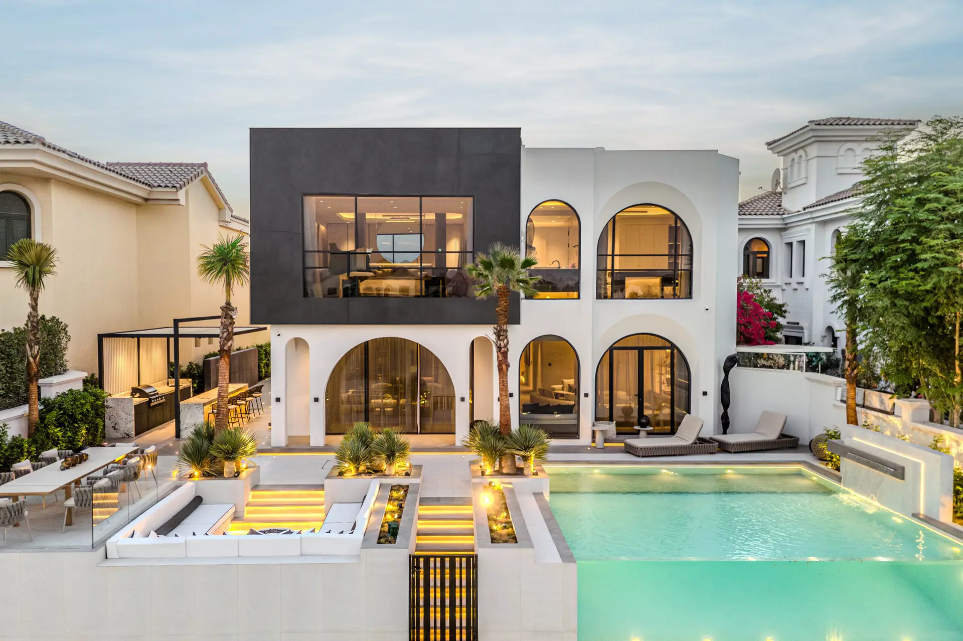 Private swimming pool with turquoise tiles and surrounding deck in K4's luxury villa on Palm Jumeirah.