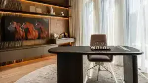Sophisticated library and cigar lounge with custom joinery and ambient lighting in K4's villa.