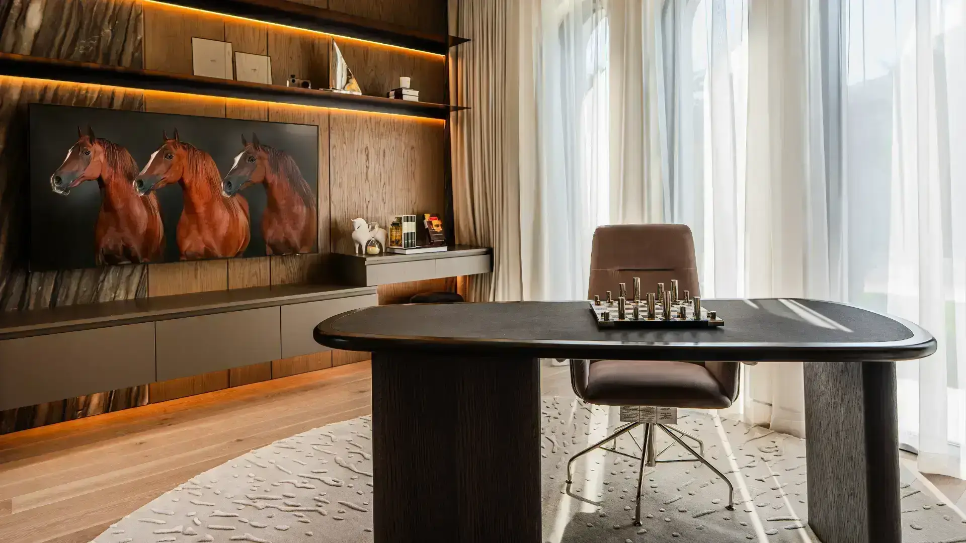 Sophisticated library and cigar lounge with custom joinery and ambient lighting in K4's villa.