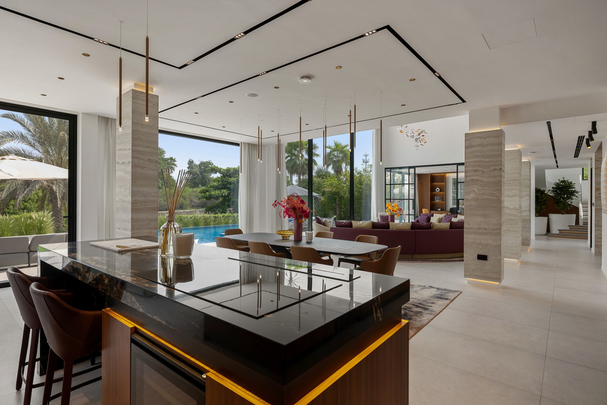 Open kitchen island and dining area with garden views