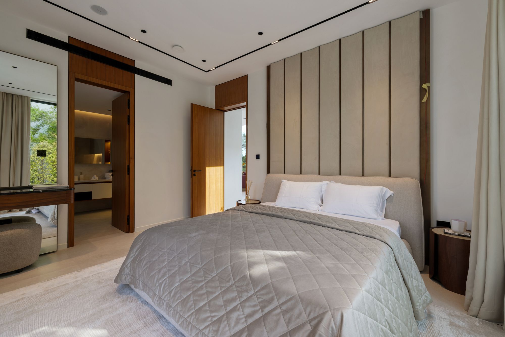 Bedroom with upholstered feature wall