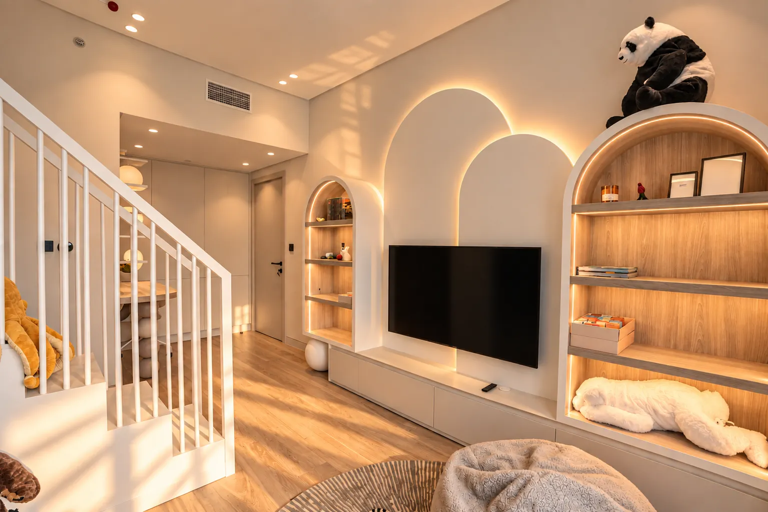 Children’s playroom with arched lit shelving